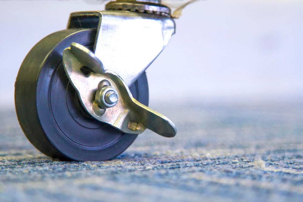 Heavy-duty casters mounted on industrial equipment